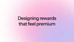 A soft pink and purple gradient graphic with the text Designing rewards that feel premium.