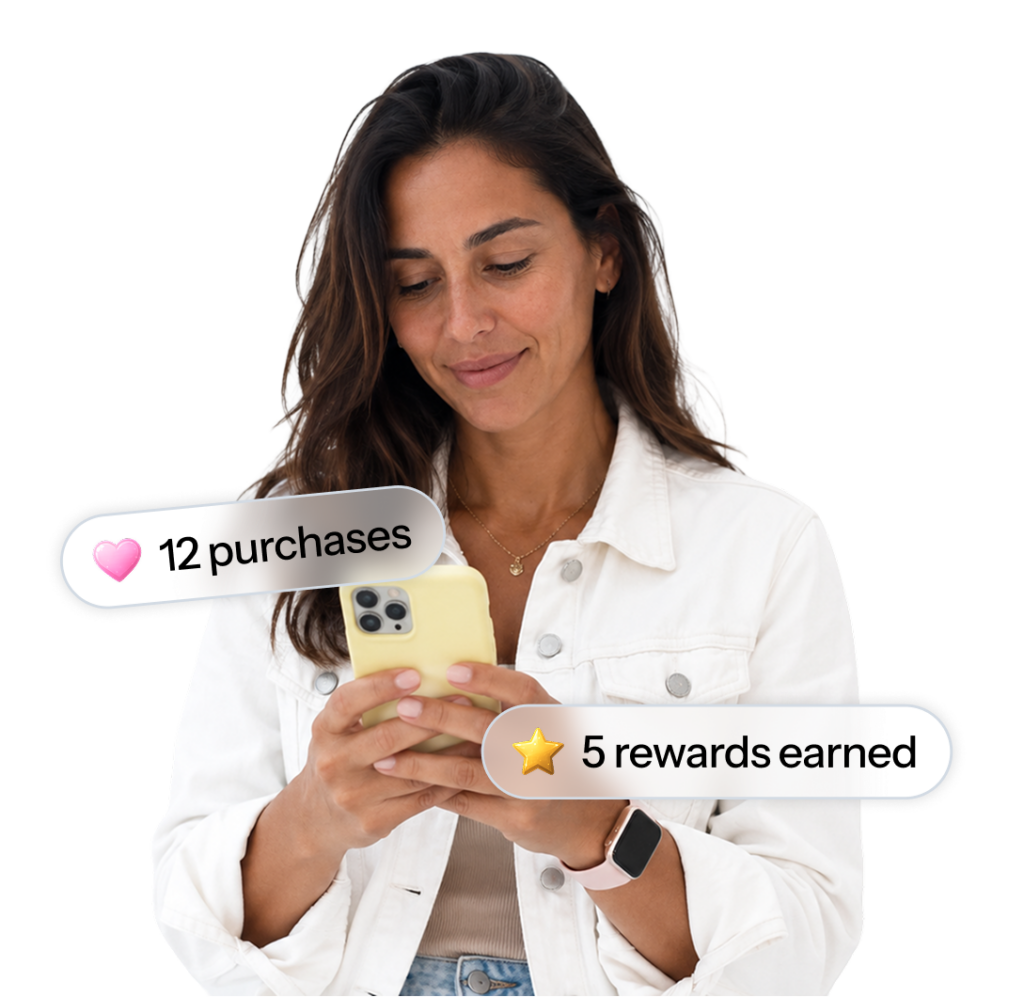 A woman looking at a phone that plays a personalized loyalty video, illustrating the loyalty and CRM managers use case.